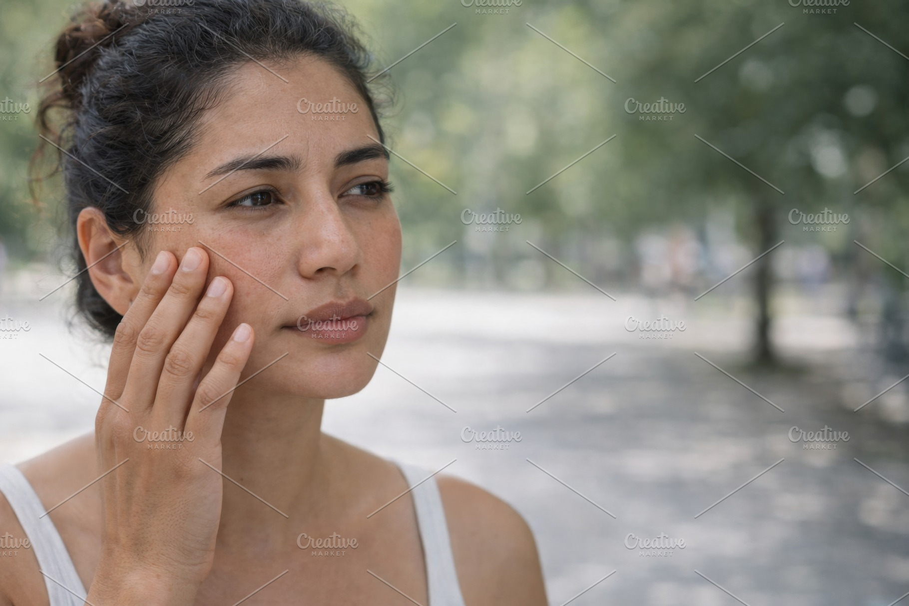 Woman outdoors care for skin under s, a Photo by Dvoevnore photos