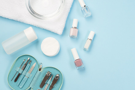 Spa set, manicure or pedicure equipment with nail coat or polish, on blue backg, a Beauty & Fashion Photo by iuliia_n