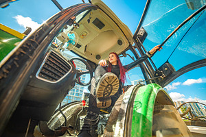 Edgy red haired girl posing inside tractor cabin with fisheye ef, a Photo by Pictures for you!!!!!!!!!