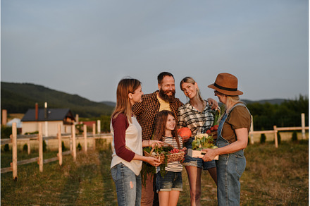 Happy farmer family holding their, a Person Photo by HalfPoint