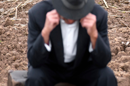 emigrant with suitcase and vintage suit leaving his village to l