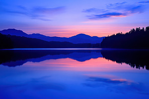 Twilight hues illuminate calm lake s, a Photo by Iftikhar Alam