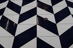 Geometric wet tile pattern featuring black and white designs captured in Denmar, a Photo by AS photostudio