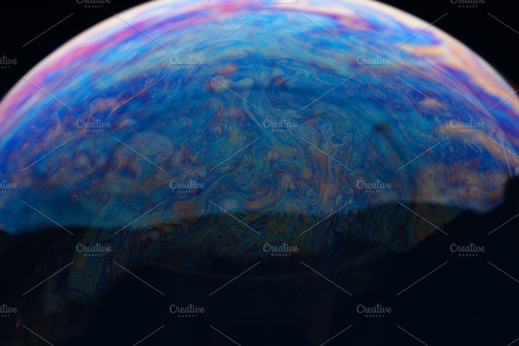 Close-up of a soap bubble with vibrant, swirling patterns and co, a Person Photo by Ales Munt