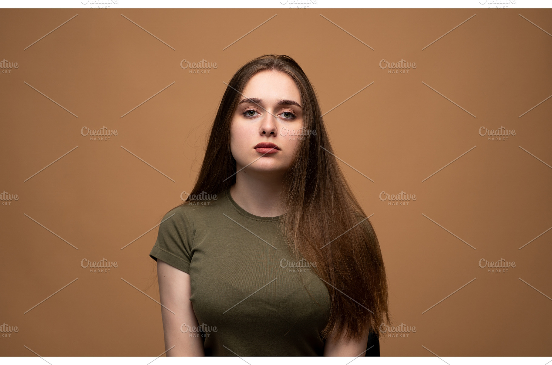 Young woman posing in a studio, a Person Photo by volodymyrshtun13795