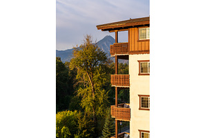Wooden balconies on Alpine styled, an Architecture Photo by Backyard Stock