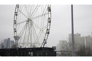 Ferris wheel rotating slowly on, an Architecture Photo by Media Whale Stock