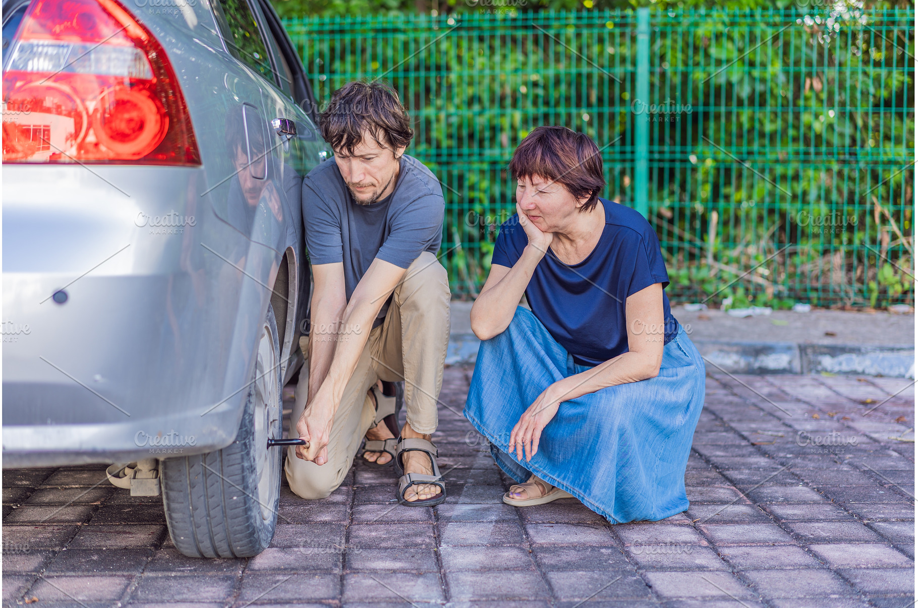 Young man helping an older woman by, a Transportation Photo by Elizaveta Galitskaya