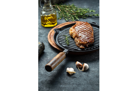Fried strip loin steak on vintage, a Food & Drink Photo by LARISA BLINOVA