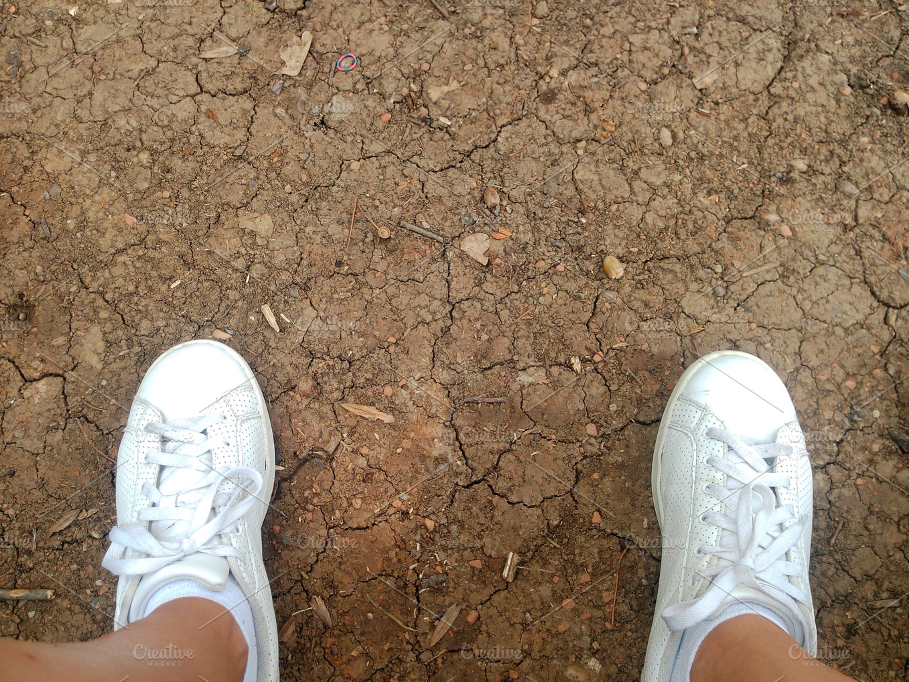 Dirty Cracked Soil with sneakers, an Abstract Photo by TrixVFX