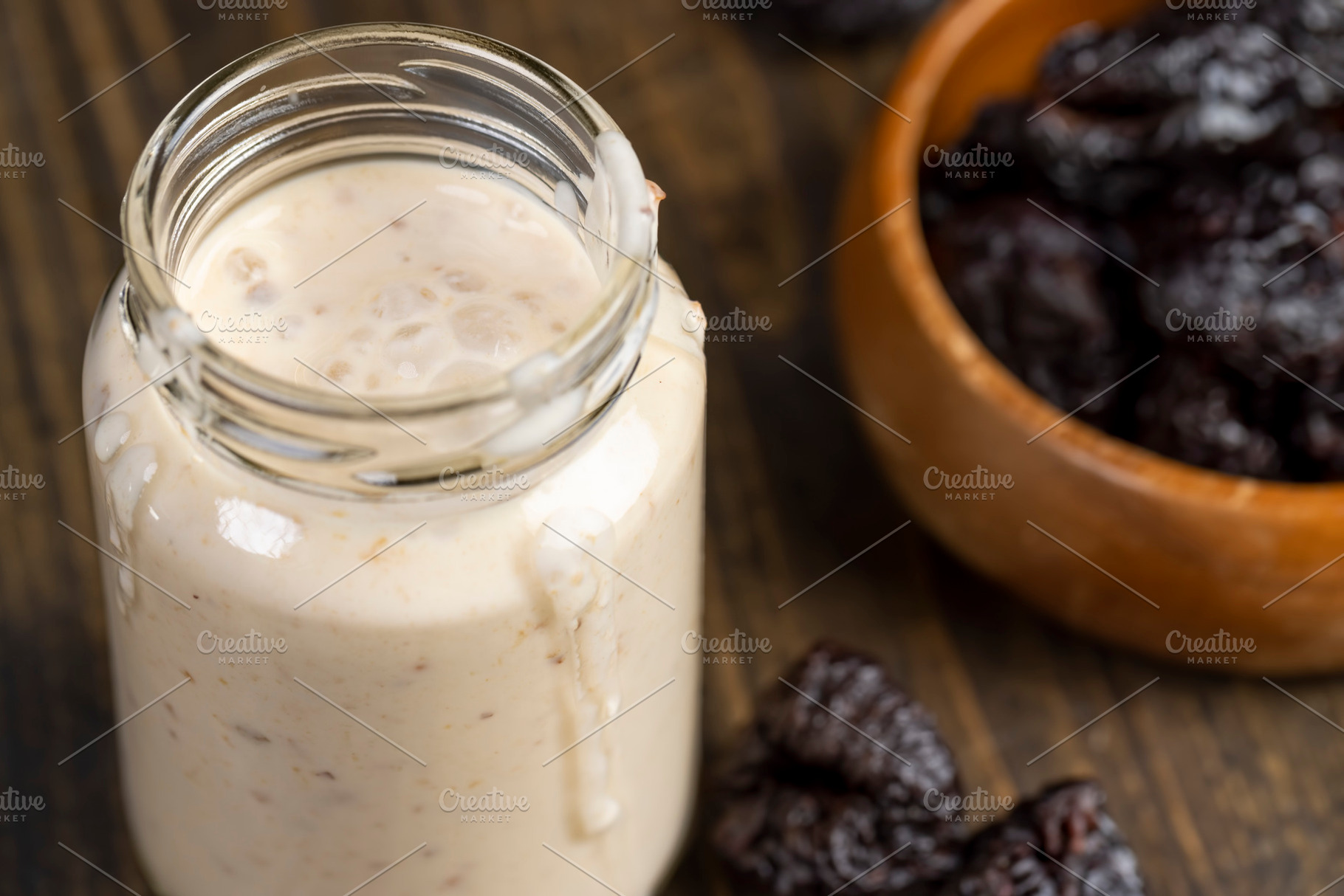 fresh cow's milk yogurt with prune flavor with dried plum slices, a Photo by rsoollAI