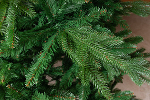 Realistic green artificial Christmas tree branches background, a Holiday Photo by Antonio Gravante Market