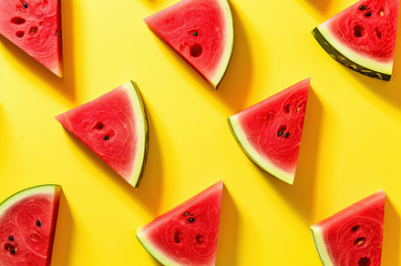 Sliced watermelon on yellow background. Generative AI, a Food & Drink Photo by AlyaAnd
