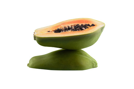 half sliced green papaya isolated on white background, balance c, a Food & Drink Photo by Ales Munt