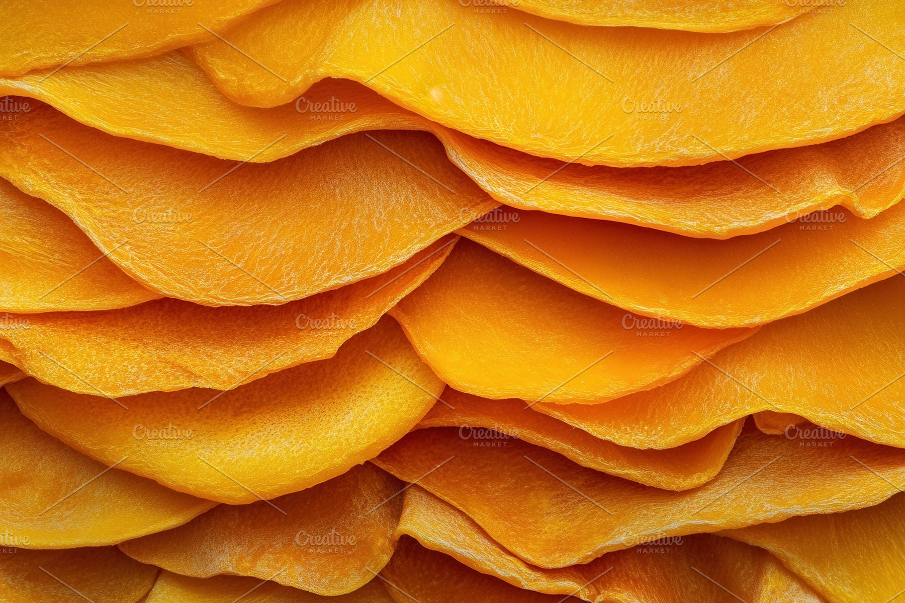 Sweet dried mango slices stacked, a Photo by Pavel_design