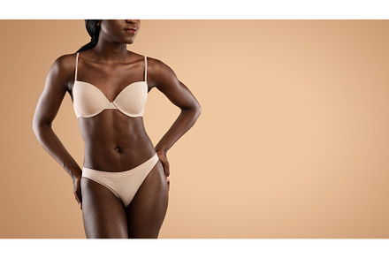 Cropped of black woman in underwear, a Person Photo by Prostock-Studio