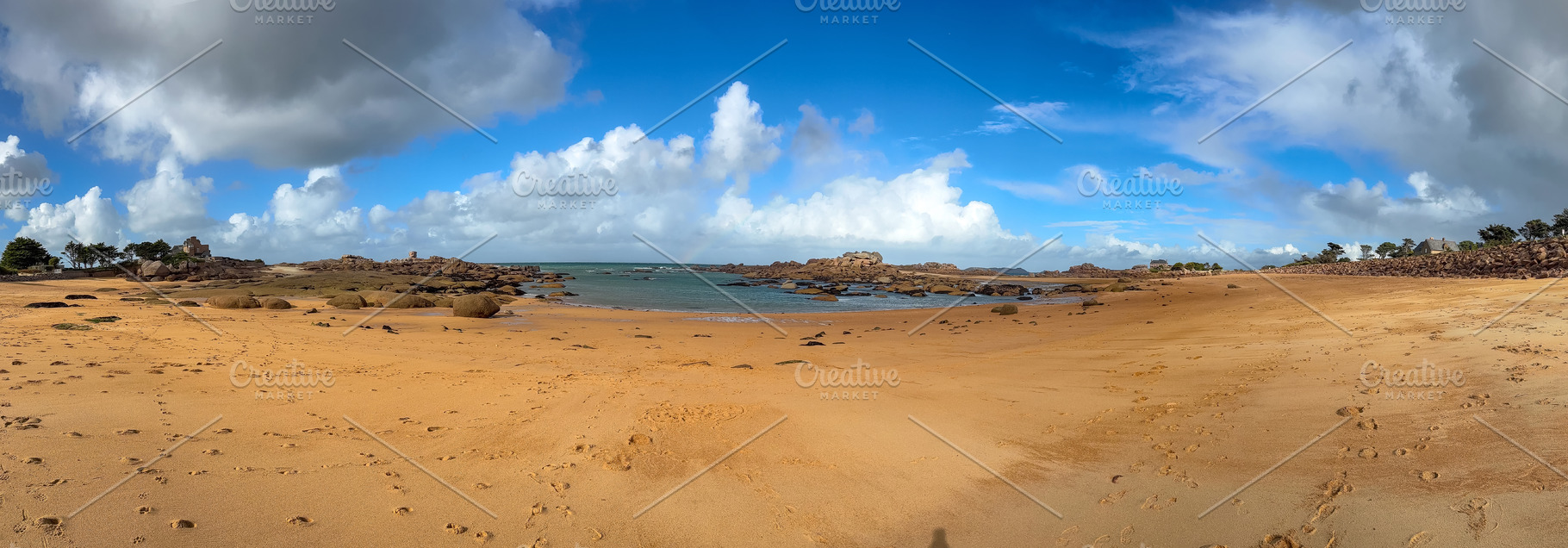Rocky tidal island under bright skies in Tregastel, Brittany, Fr, a Nature Photo by GoodGoods