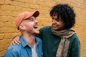 Young Couple Laughing Together, a Person Photo by Virgo Studio