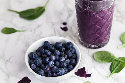Blueberry smoothie in glass featuring smoothie, modern kitchen, and healthy