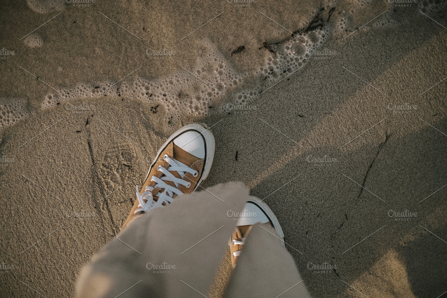 Feet in sneakers near water, a Person Photo by Valeriia Miller