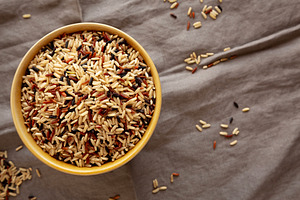 Organic Dry Asian Wild Rice in a Bowl, top view. Flat lay, overh, a Food & Drink Photo by LiudmylaChuhunova