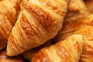 Freshly baked croissants forming an appetising background for fr, a Food & Drink Photo by Olena Rudo