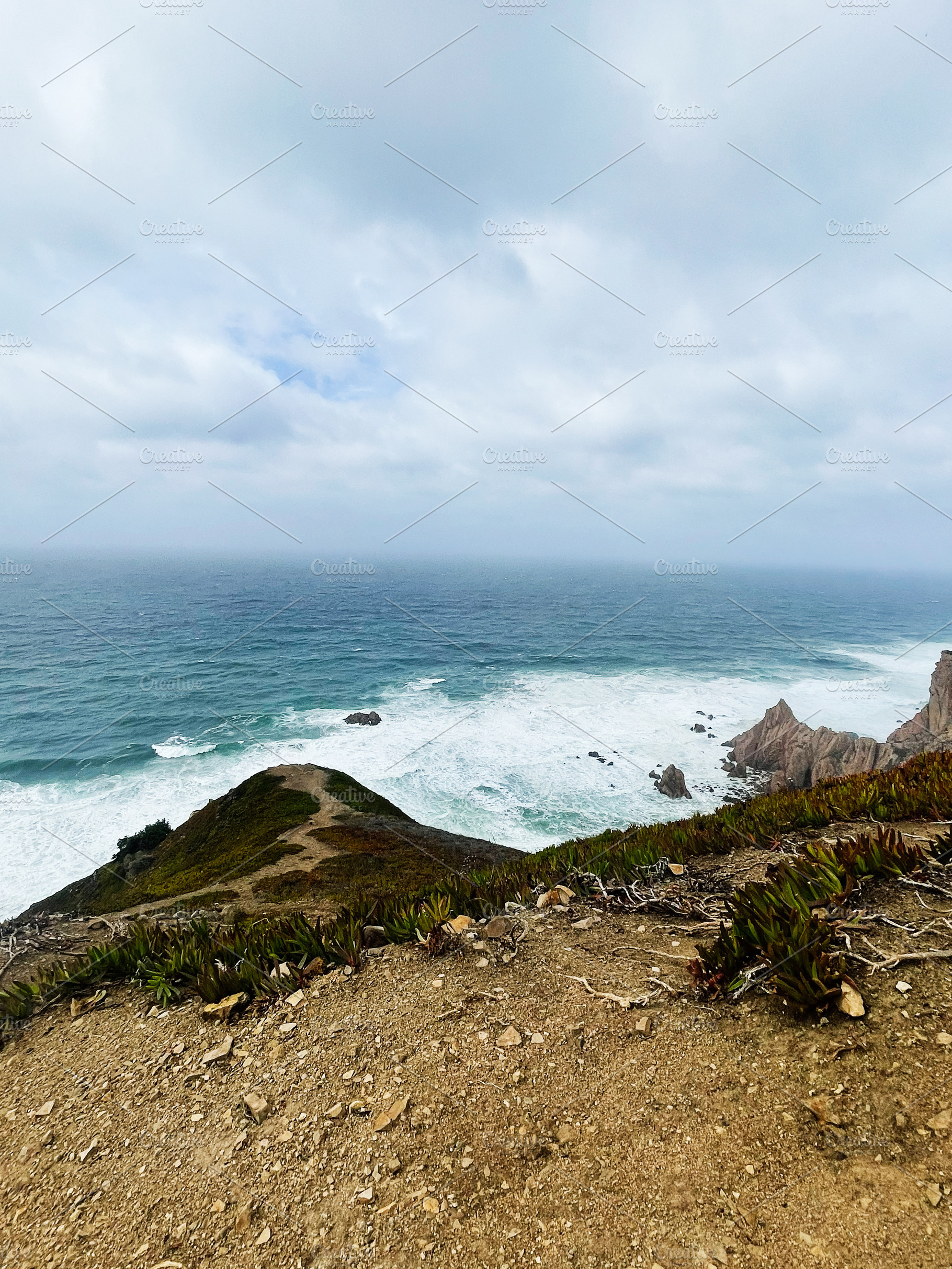 Coastal cliff path over the Atlantic near Portugal with rugged terrain and sea, a Photo by AS photostudio