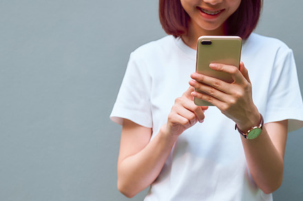 Closeup of woman holding a smartpho stock photo containing phone and mobile
