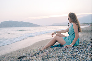 Woman in Flowing Dress on Seaside, a Person Photo by Jan Jack Russo Media