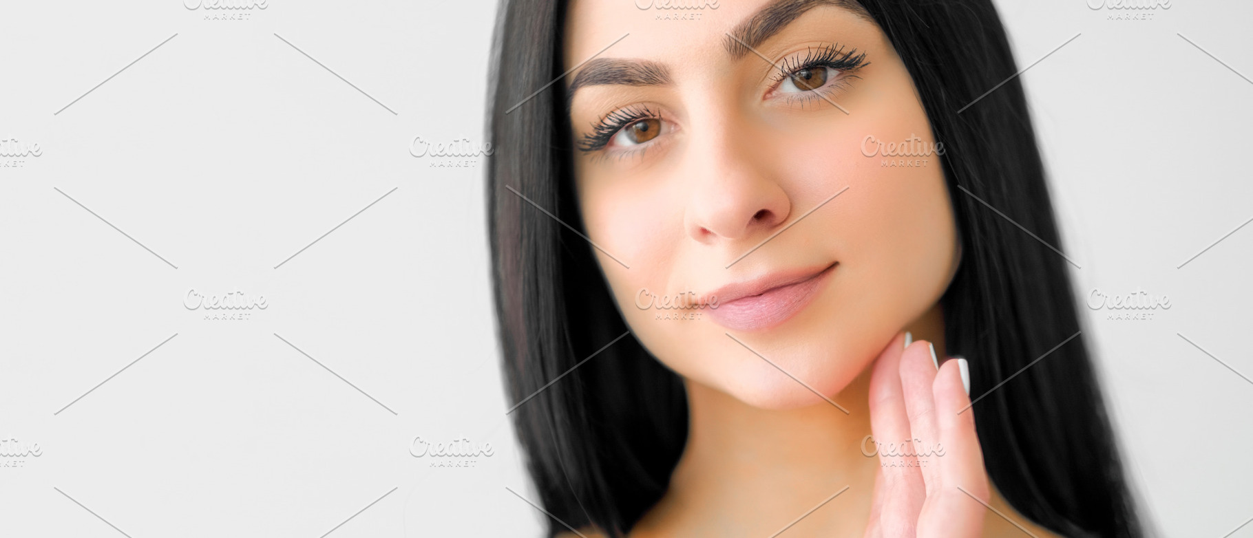 Healthy skin makeup routine woman caressing face, a Person Photo by Photo Drive Studio