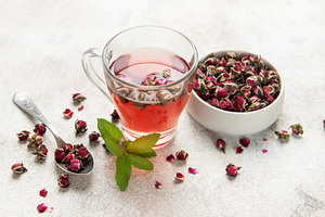 Rose tea infusion with dried buds and fresh mint leaf, a Food & Drink Photo by Olena Rudo