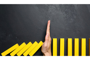 Hand stopping falling blocks as a, a Business Photo by Igor Tichonow