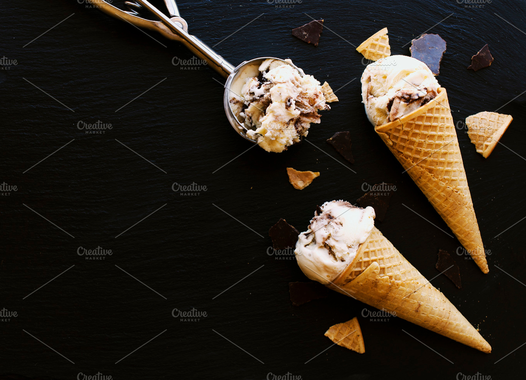 Chocolate ice cream in a sugar waffle cones containing ice, cream, and scoop, a Food & Drink Photo by Wild Drago Shop