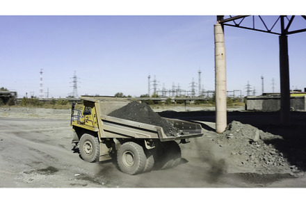 A Heavy Duty Dump Truck is Unloading, a Transportation Photo by Media Whale Stock