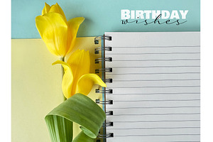 Yellow tulips with a spiral notebook, a Photo by tilialucida