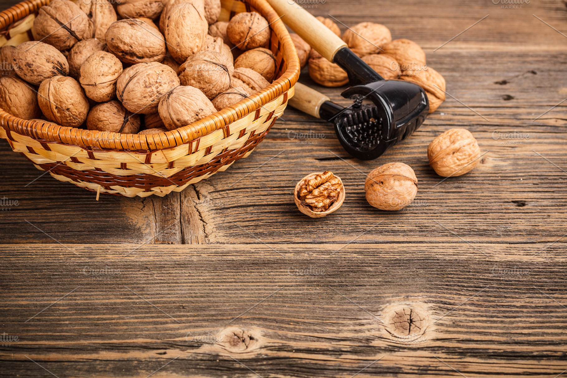 Nuts and nutcracker stock photo containing basket and brown