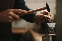 Jewelry designer shaping a ring by  in Photos