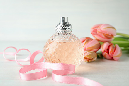 Concept of female perfume on white wooden table, a Beauty & Fashion Photo by AtlasStudio