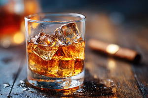 Whiskey on the rocks in a glass, a Food & Drink Photo by AlyaAnd