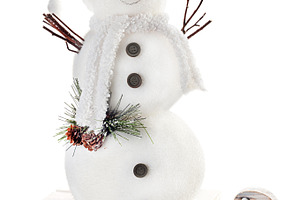 Snowman on sled isolated on white ba