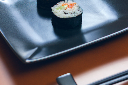 Sushi maki rolls on a tray containing wood table, sushi, and maki roll, a Food & Drink Photo by davidpereiras