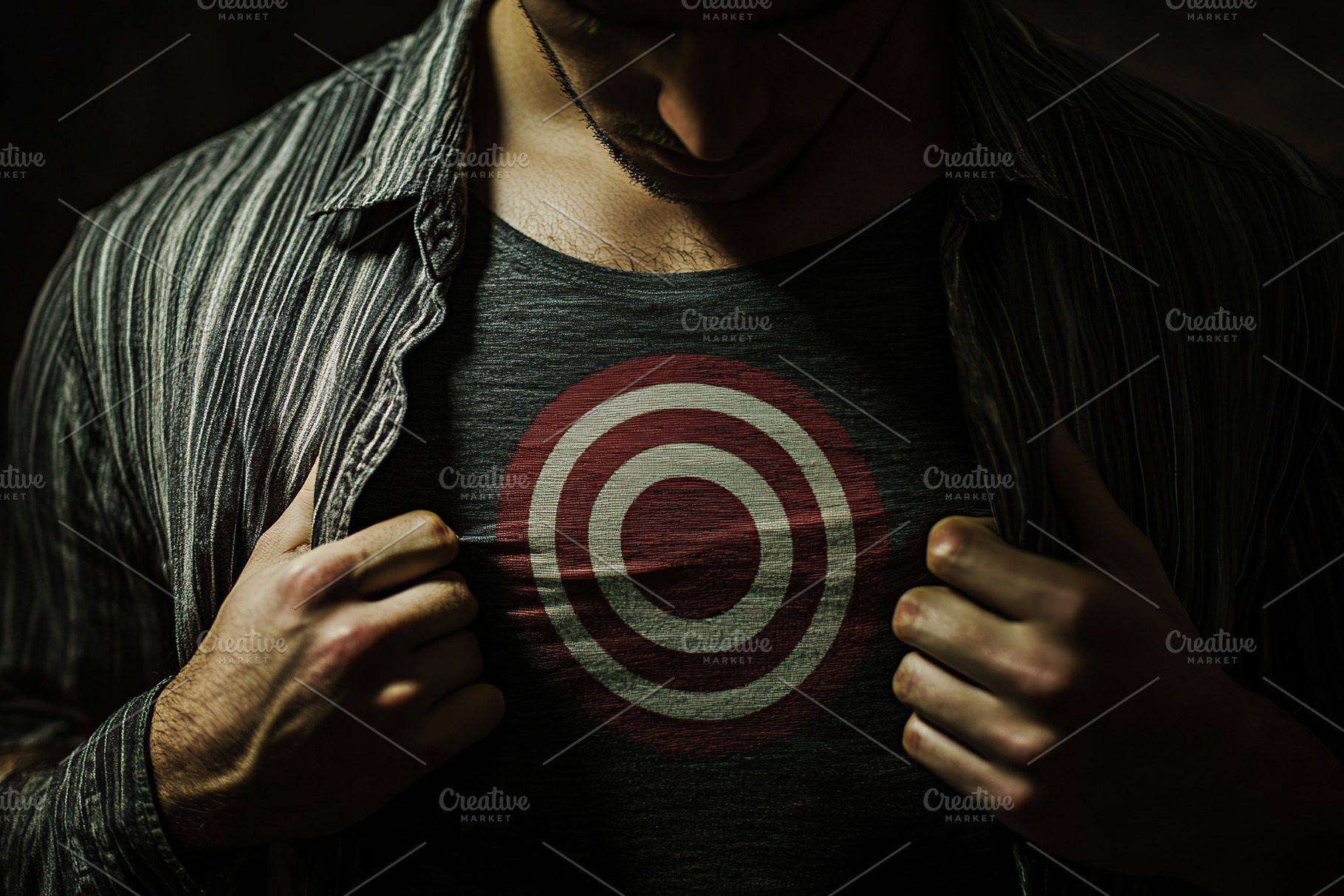 Man with a target symbol on his chest, a Person Photo by AlyaAnd