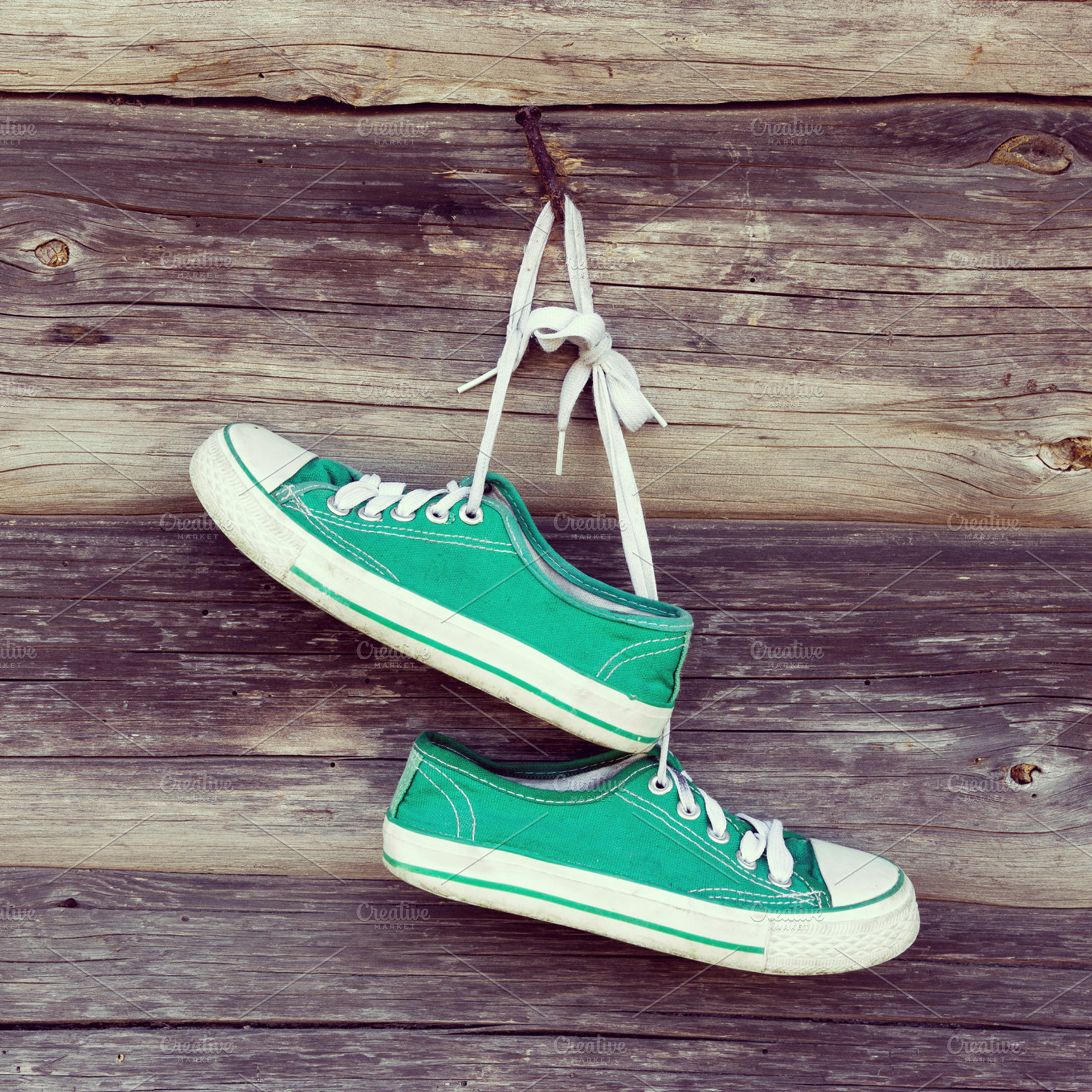 Old sneakers on wooden wall, a Sports & Recreation Photo by BOOCYS