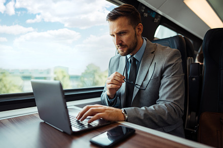 Businessman in fast train, a Transportation Photo by REDDOT Studio