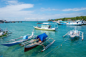 Fishing boats in Bira harbor, Sulawesi, Indonesia on clear day, a Transportation Photo by GoodGoods