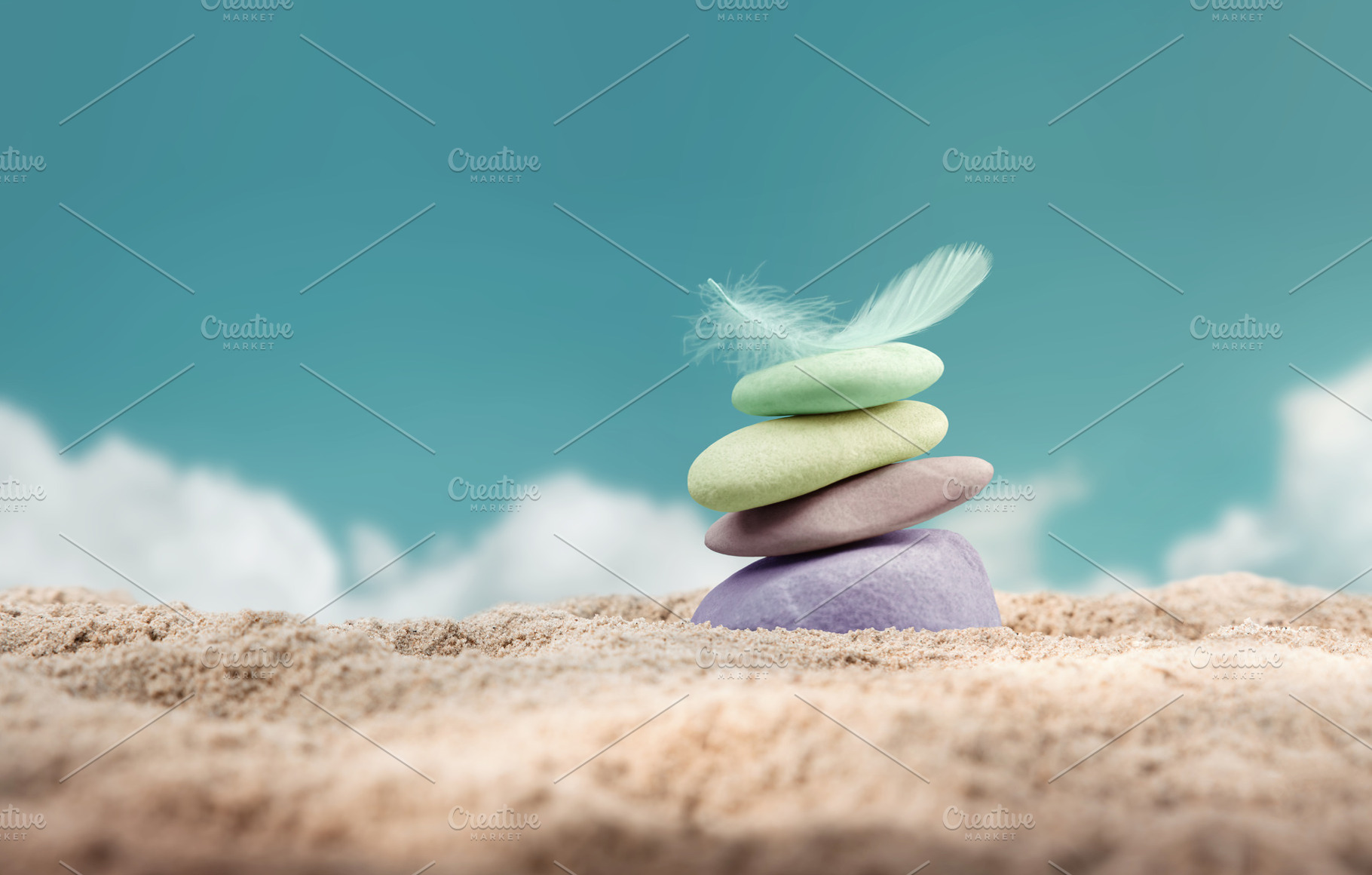 Calm and stable mindset.Balanced colorful stones and feather on, a Photo by salmon.black