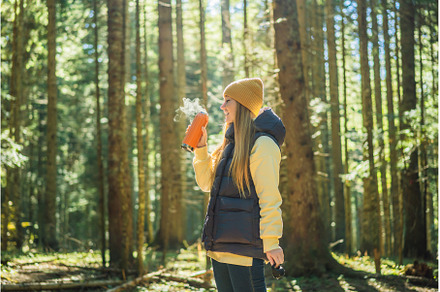 Woman in warm clothes drinking tea, a Nature Photo by Elizaveta Galitskaya