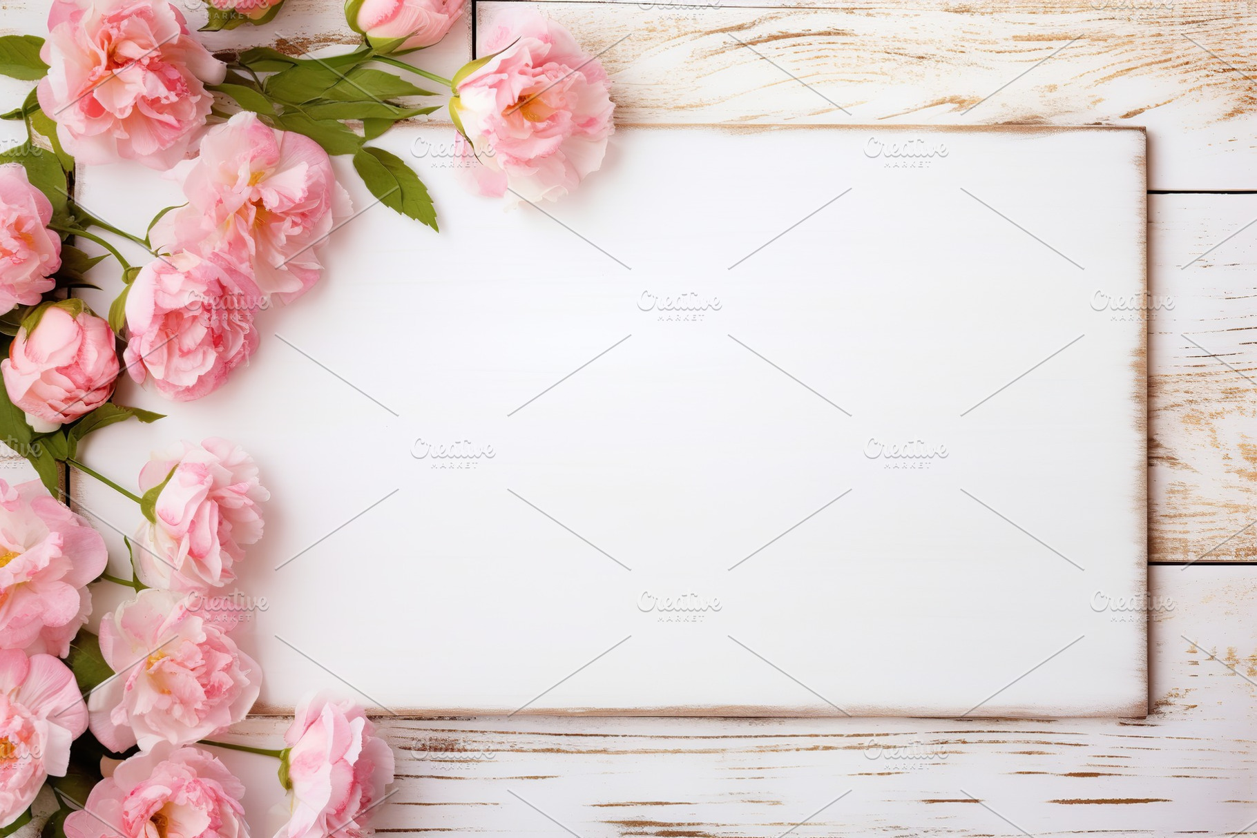 Bouquet of pink flowers with blank frame on white wooden background, a Background Photo by AlyaAnd