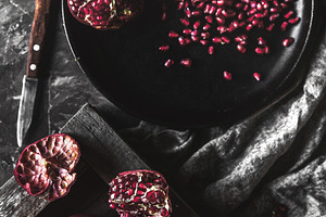Pomegranate in a black box on a dark