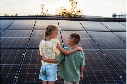 Two young siblings on roof with